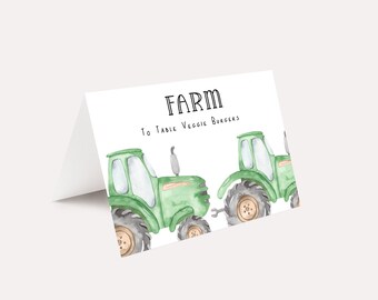 May include: A white card with the text "FARM To Table Veggie Burgers" and two green toy tractors.