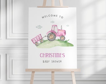May include: Welcome to Christine's Baby Shower sign with a pink tractor pulling a wagon on a green hill with white clouds in the background.