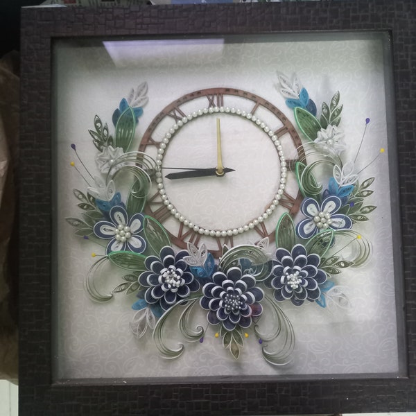 Wall clock with paper quilling and frame
