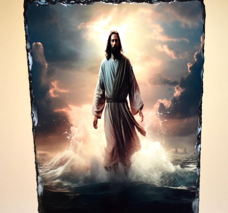 May include: A religious image on a slate tile. The image depicts a figure in flowing robes standing in water, with a bright, cloudy sky in the background. The figure has long hair and a beard, and the water is splashing around their feet.