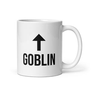 May include: White ceramic coffee mug with a black arrow pointing upwards and the word "GOBLIN" printed below it.