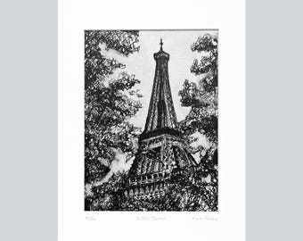 May include: A monochrome print of the Eiffel Tower, depicted through a network of lines, with trees framing the structure. The artwork is titled "Eiffel Tower" and is signed and numbered. It is mounted on a white mount.