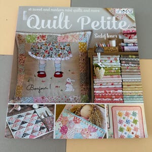 May include: A book titled "Quilt Petite" with the text "18 sweet and modern mini quilts and more." The cover features a patchwork design with a doll illustration and the word "Bonjour!". Additional images showcase various quilt projects.