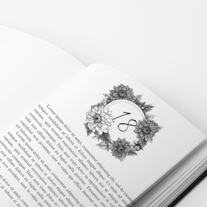 May include: A black and white illustration of a floral wreath with the number 18 in the center. The wreath is made up of dahlias and other flowers.