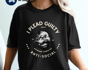 May include: Black t-shirt with a white graphic of a duck with the text "I plead guilty 24/7 to be anti-social without remorse".
