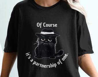 May include: Black t-shirt with a cartoon black cat wearing a fedora hat. The text "Of Course it's a partnership of one." is printed on the shirt.