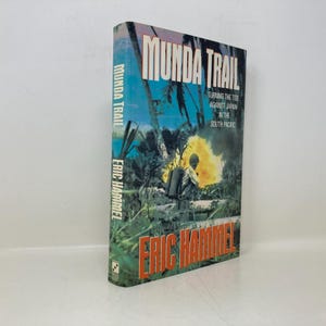 May include: A book titled "Munda Trail: Turning the Tide Against Japan in the South Pacific" by Eric Hammel. The cover features a jungle scene with a soldier in the foreground.