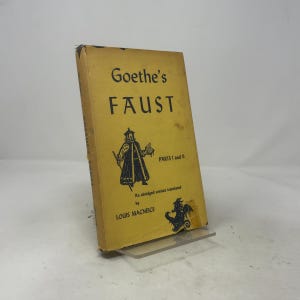 May include: A yellow paperback book titled Goethe's Faust Parts I and II, an abridged version translated by Louis MacNeice. The cover features black text and a black illustration of a figure in a long coat and a dragon-like creature.