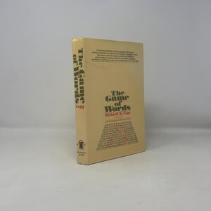 May include: A hardcover book titled "The Game of Words" by Willard R. Espy. The book has a tan cover with black and red text. The title is displayed vertically on the spine and horizontally on the front cover.