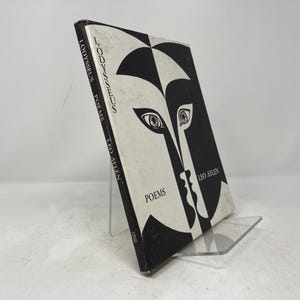 May include: A black and white book titled "I, Odysseus - Poems" by Leo Aylen. The cover features a stylized black and white illustration of a face.