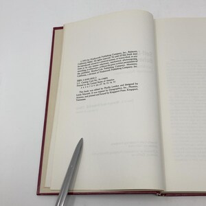 May include: A white book with black text on the cover. The text reads "1973 by Wadsworth Publishing Company, Inc., Belmont, California 94002. All rights reserved. No part of this book may be reproduced, stored in a retrieval system, or transmitted, in any form or by any means-electronic, mechanical, photocopying, recording, or otherwise-without the prior permission of the publisher, a division of Wadsworth Publishing Company, Inc., Monterey, California."