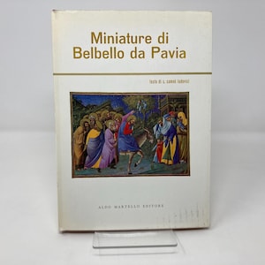 May include: A book titled "Miniature di Belbello da Pavia" with a colorful illustration of a group of people in medieval clothing on the cover. The text "testo di U. G.  Samek Lodovici" is printed below the title.