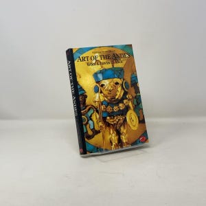 May include: A book titled "Art of the Andes from Chavin to Inca" by Rebecca Stone Miller. The cover features a colorful illustration of a gold and turquoise figure with a headdress.