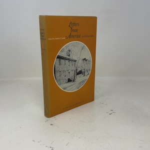 May include: A hardcover book titled "Letters from America" by William Faux. The book has a mustard-colored cover with the title in brown script and a circular illustration of a building. The book is part of the John Harvard Library.