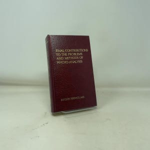 May include: A maroon hardcover book titled "FINAL CONTRIBUTIONS TO THE PROBLEMS AND METHODS OF PSYCHO-ANALYSIS" with gold lettering. The author's name, SANDOR FERENCZI M.D., is also in gold. The book is standing upright.