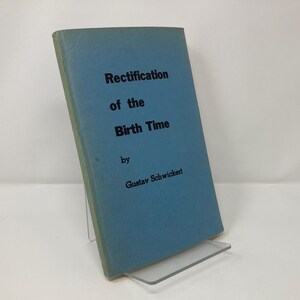 May include: A blue book titled "Rectification of the Birth Time" by Gustav Schwickert.