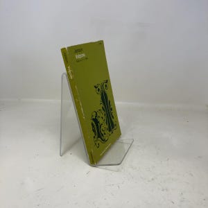 May include: A vintage copy of "Jonson Volpone" with a green cover and black decorative design. The book is displayed on a clear acrylic stand. The title and author's name are printed on the spine and cover.