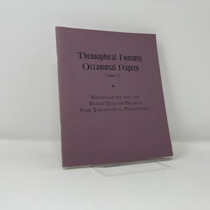 May include: A purple book titled "Theosophical History Occasional Papers Volume V" with the text "Krishnamurti and the World Teacher Project: Some Theosophical Perceptions" on the cover.