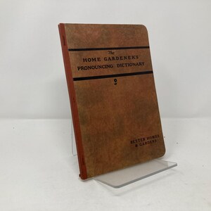 May include: A brown book titled "The Home Gardener's Pronouncing Dictionary" with the words "Better Homes & Gardens" printed on the bottom.