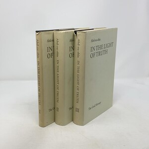 May include: Three hardcover books titled "In the Light of Truth" by Abd-ru-shin. The books are in a light beige color with black text. The spines display the title and author's name. The first three volumes are labeled I, II, and III.