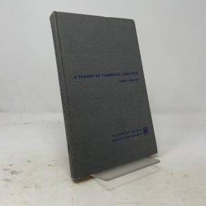 May include: A gray hardcover book titled A Theory of Financial Analysis by Lerner and Carleton. The cover features blue text and the logo for The Harbrace Series in Business and Economics. The spine also displays the book title in blue text.