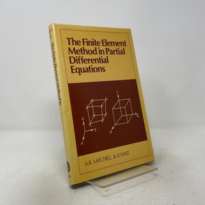 May include: A hardcover book titled The Finite Element Method in Partial Differential Equations by A.R. Mitchell and R. Wait. The cover is yellow with a dark red rectangular section featuring white line drawings of two cubes with axes.