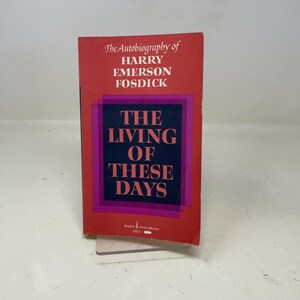 May include: A red hardcover book titled "The Autobiography of Harry Emerson Fosdick". The book's cover features the title "The Living of These Days" in a purple and pink box.