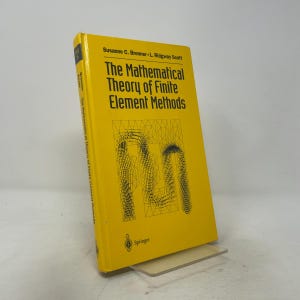 May include: A yellow hardcover textbook titled The Mathematical Theory of Finite Element Methods by Susanne C. Brenner and L. Ridgway Scott. The cover features black text and a black line-drawn mesh diagram, with the Springer logo at the bottom.