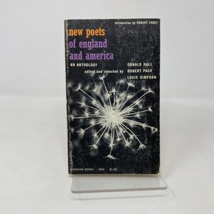 May include: A vintage paperback book titled "New Poets of England and America." The cover is black with white and purple text, featuring a dandelion-like illustration. The book is an anthology edited by Donald Hall, Robert Pack, and Louis Simpson.