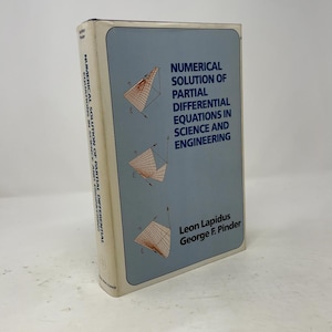 May include: A hardcover textbook titled Numerical Solution of Partial Differential Equations in Science and Engineering by Leon Lapidus and George F. Pinder. The cover is light blue with three orange grid-based mathematical surface plots.