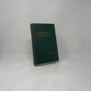 May include: A hardcover book titled "The Celebrated Case of Fitz John Porter" in a dark green cover. The title and author's name are in gold lettering. The book is slightly angled, showcasing its spine and front cover.