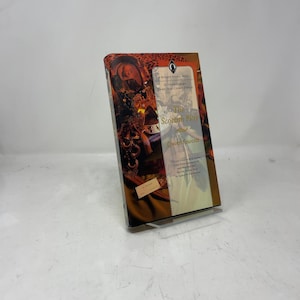 May include: A hardcover book titled "The Scottish Play" by Quinn Fawcett. The book has a colorful cover with images of people and objects. The book is set against a white background.