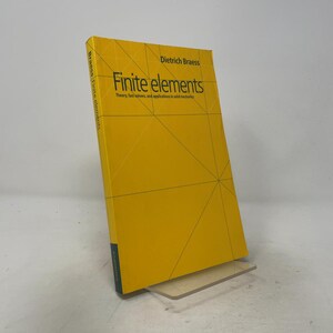 May include: A yellow hardcover textbook titled Finite elements: Theory, fast solvers, and applications in solid mechanics by Dietrich Braess. The cover features a geometric pattern of thin black lines and the spine displays the author and title.