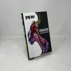 May include: A hardcover book titled "Sleepside: The Collected Fantasies" by Greg Bear. The cover features a white background with a swirling, abstract design in shades of red, purple, and green. The title and author's name are in black.