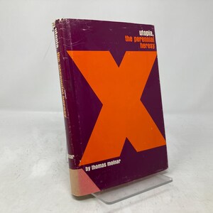 Puede incluir: Un libro titulado "Utopia, The Perennial Heresy" de Thomas Molnar. La portada presenta una gran "X" naranja sobre un fondo morado.