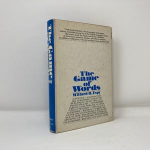 May include: The Game of Words by Willard R. Espy, a blue and white book cover with the title in bold blue letters. The book contains examples of wordplay, including acrostics, alliteration, malapropisms, acronyms, burlesques, puns, spelling, pidgin English, euphemisms, parody, conundrums,  tongue-twisters, univocalics,  clerinews, riddles, anagrams, oxymorons,  sick humor, tom swifties,  epitaphs, cryptograms, palindromes, rebus, and many more.