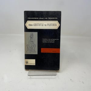 May include: A vintage book titled "From Aristotle to Plotinus" from the "Philosophers Speak for Themselves" series. The cover is black with white text and a graphic of a philosopher. The book is edited by T.V. Smith.