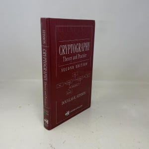 May include: A maroon book titled "Cryptography Theory and Practice, Second Edition" by Douglas R. Stinson. The spine reads "Stinson Cryptography Theory and Practice". The publisher's logo is at the bottom.