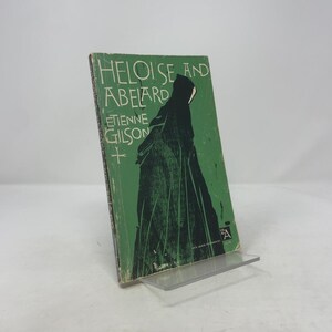 May include: A vintage book titled "Heloise and Abelard" by Etienne Gilson. The cover is green with black text and a silhouette of a figure. The book is displayed on a clear plastic stand.