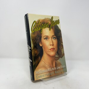 May include: A hardcover book titled Citizen Jane: The Turbulent Life of Jane Fonda by Christopher Andersen. The front cover features a portrait of Jane Fonda with the title in large gold script and the author's name in white text below.