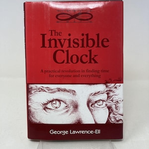 May include: A hardcover book titled "The Invisible Clock" with a red cover. The book features the title in large white letters, an infinity symbol, and the author's name, George Lawrence-Ell. The cover also includes an illustration of eyes with a clock in one eye.