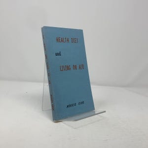 May include: A blue book titled "HEALTH DIET and LIVING ON AIR" by MORRIS KROK.