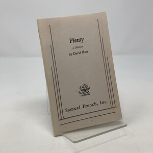 May include: A vintage copy of the play "Plenty" by David Hare, published by Samuel French, Inc. The book has a cream-colored cover with black text and decorative lines. The title and author's name are prominently displayed.