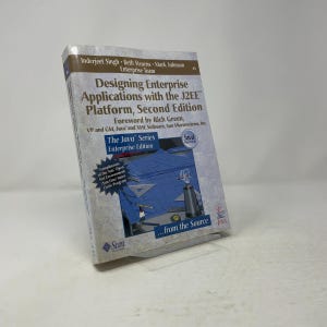 May include: A softcover technical book titled Designing Enterprise Applications with the J2EE Platform, Second Edition. The cover features a blue architectural drafting table illustration, the Sun Microsystems logo, and Java branding.