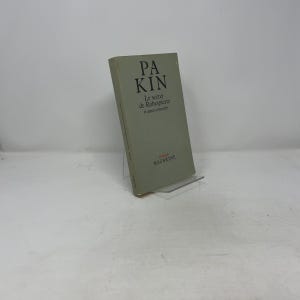 May include: A hardcover book titled "PA KIN" with the subtitle "Le secret de Robespierre et autres nouvelles" is displayed. The book has a light green cover with black text. The publisher's name, "MAZARINE", is at the bottom.