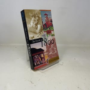 Może przedstawiać: Biały ceramiczny kubek z czarnym uchwytem i napisem "But First, Coffee" czarną, odręczną czcionką. Kubek stoi na białej powierzchni.