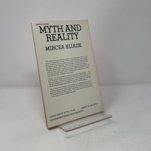 May include: A paperback book titled Myth and Reality by Mircea Eliade, featuring a cream-colored cover with black text. The back cover displays printed reviews, the ISBN 0-06-131369-6, and credits for cover design by Pat Steir and publisher Harper & Row.