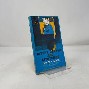 May include: A paperback book titled Myths, Dreams, and Mysteries by Mircea Eliade. The cover is bright blue with black and yellow graphic elements, featuring a stylized illustration of a person in a suit and the subtitle The Encounter Between Contemporary Faiths and Archaic Realities.