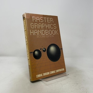 May include: A hardcover book titled Raster Graphics Handbook Second Edition by Conrac Division Conrac Corporation. The cover features a brown grid pattern with three black spheres of varying sizes and white text on the front and spine.