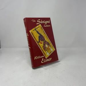 Puede incluir: Un libro de tapa dura titulado "The Sévigné Letters" de William Eisner. El libro tiene una cubierta de color rojo oscuro con letras doradas y una ilustración rectangular. La ilustración representa una figura en un marco amarillo.